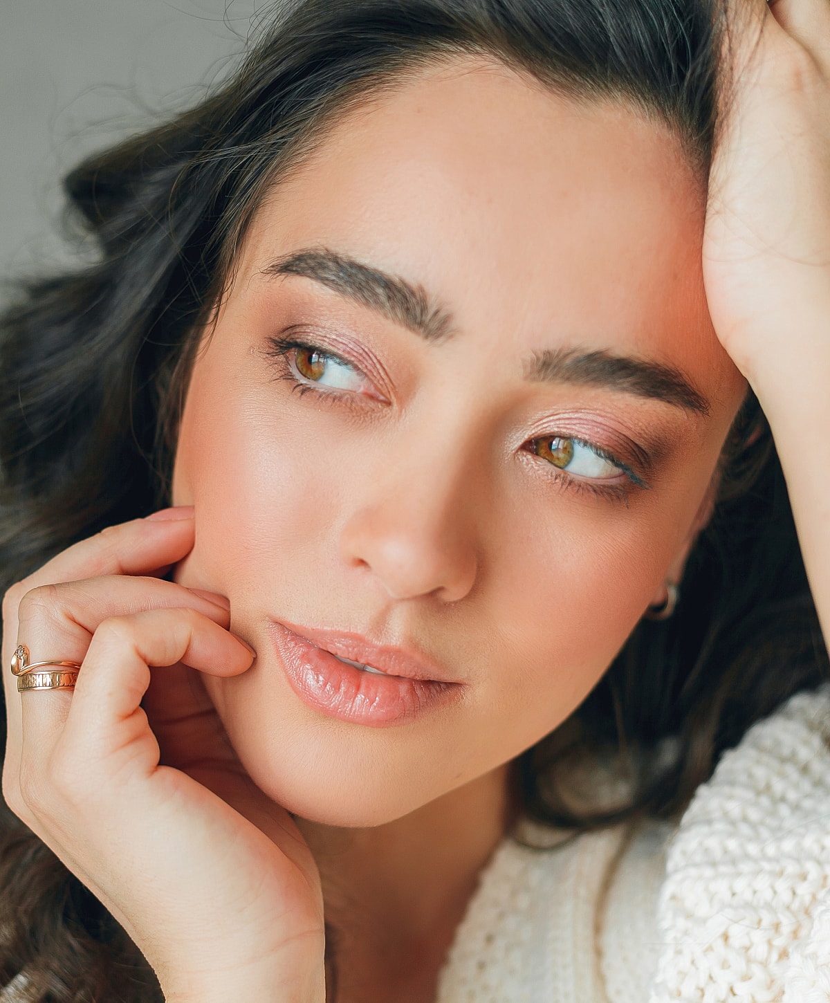 Close-up of a woman with soft makeup.