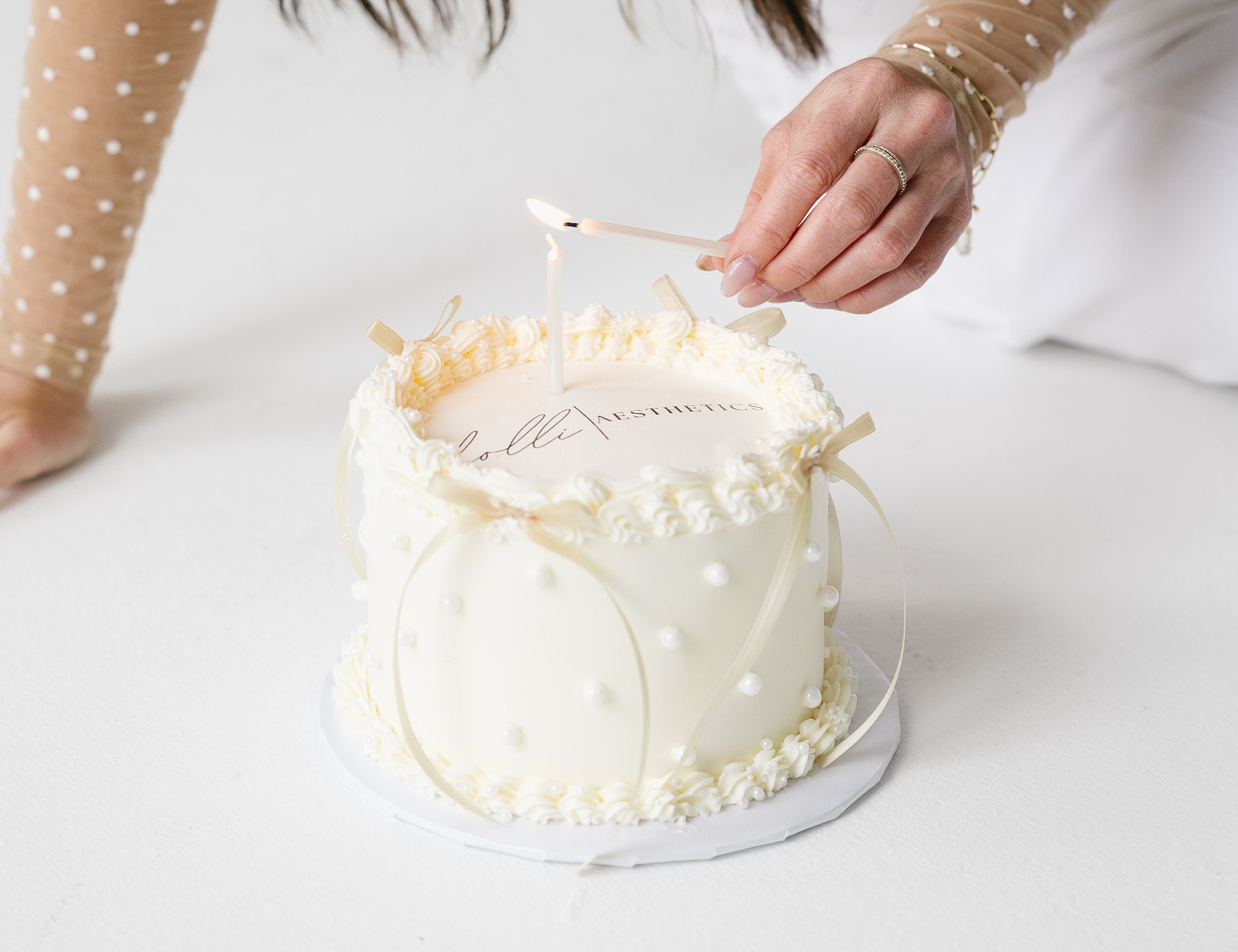 Lighting candles on a decorative birthday cake