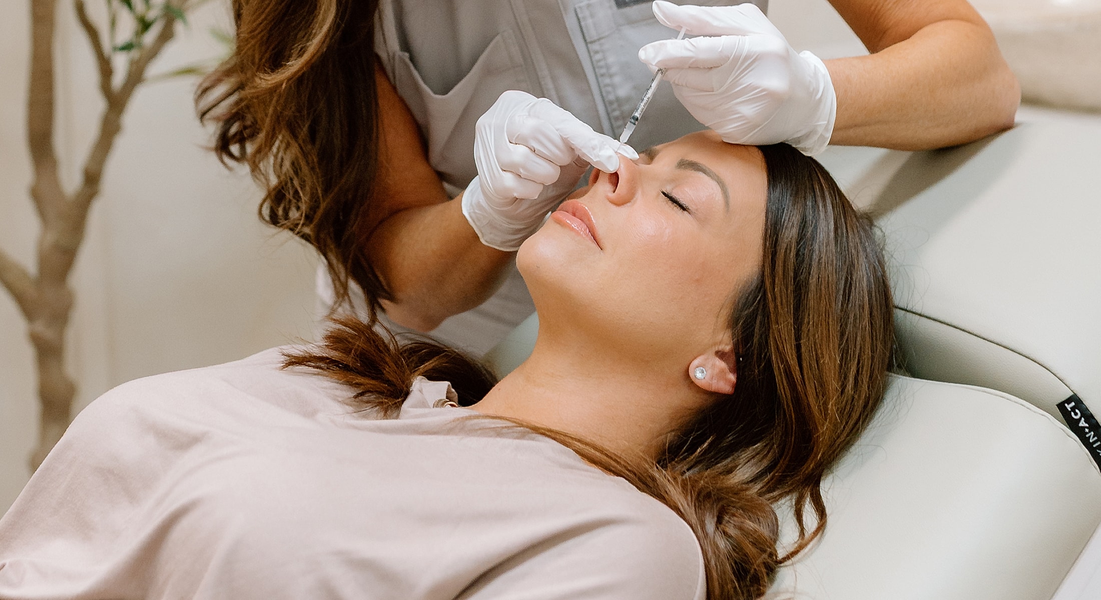 Cosmetic procedure: injecting filler into nose.